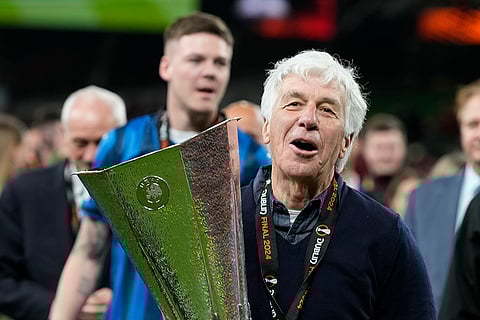 Atalanta's head coach celebrates with Europa League trophy